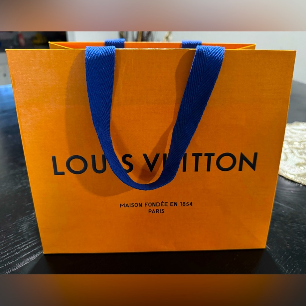 Louis Vuitton Authentic Orange Shopping Bag w/Blue Handles. 8.25"H×9.875”Lx6w”W.